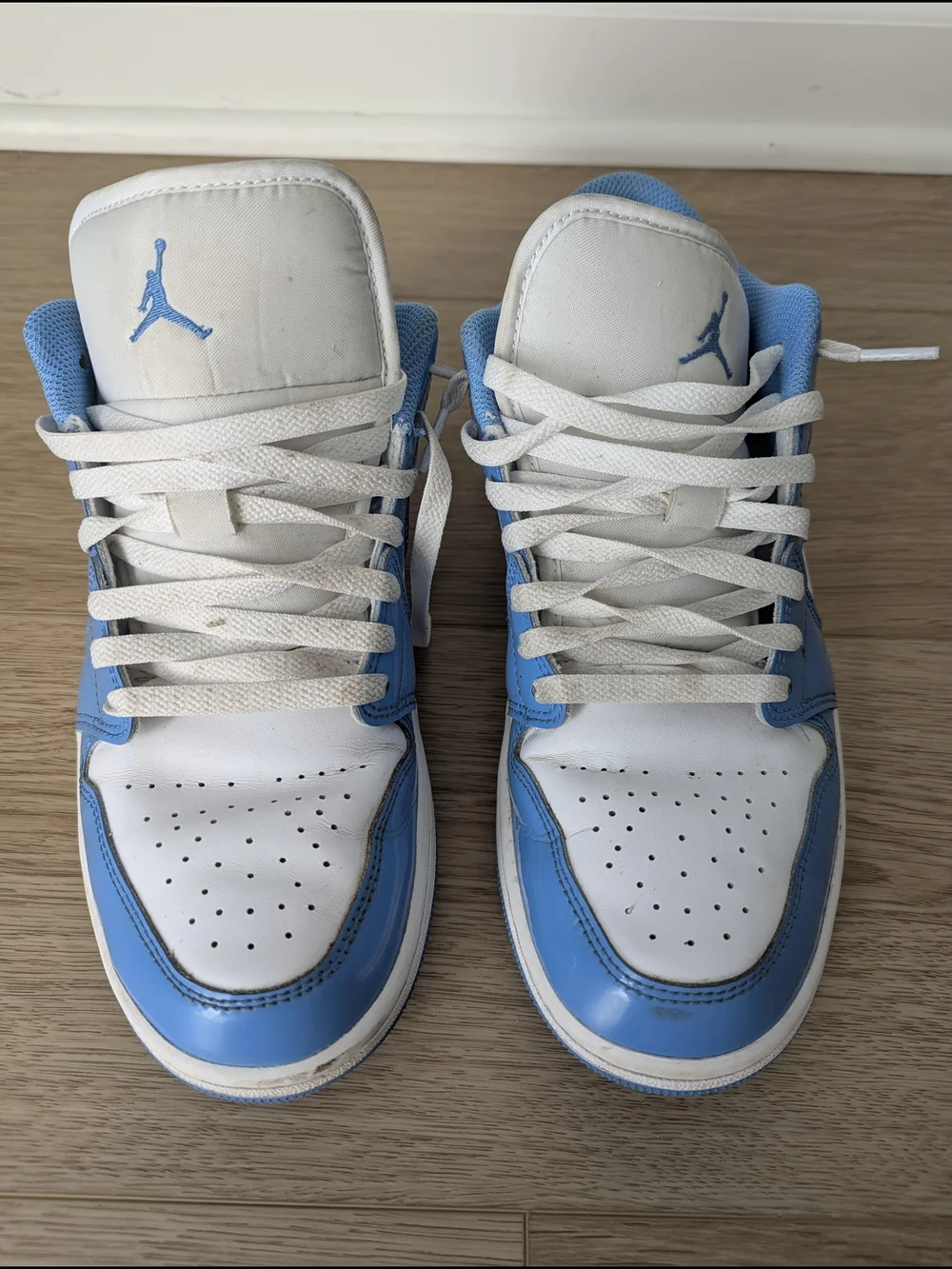 Jordan Men’s Low Top Sneakers in White & University Blue